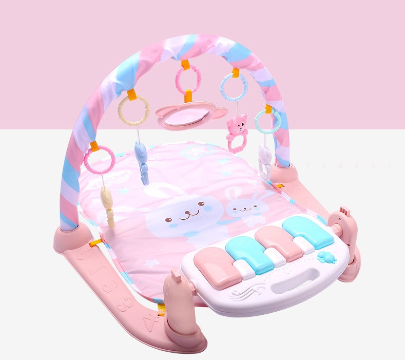 תמונה שלישית: שטיח פעילות לתינוק עם קשת צעצועים ומקלדת פסנתר בצבעי ורוד, לבן וכחול, בצורת ארנב עם צעצועים תלויים.